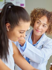 Female doctor doing an examination of her patient | Is it allergies or infection? | Blog